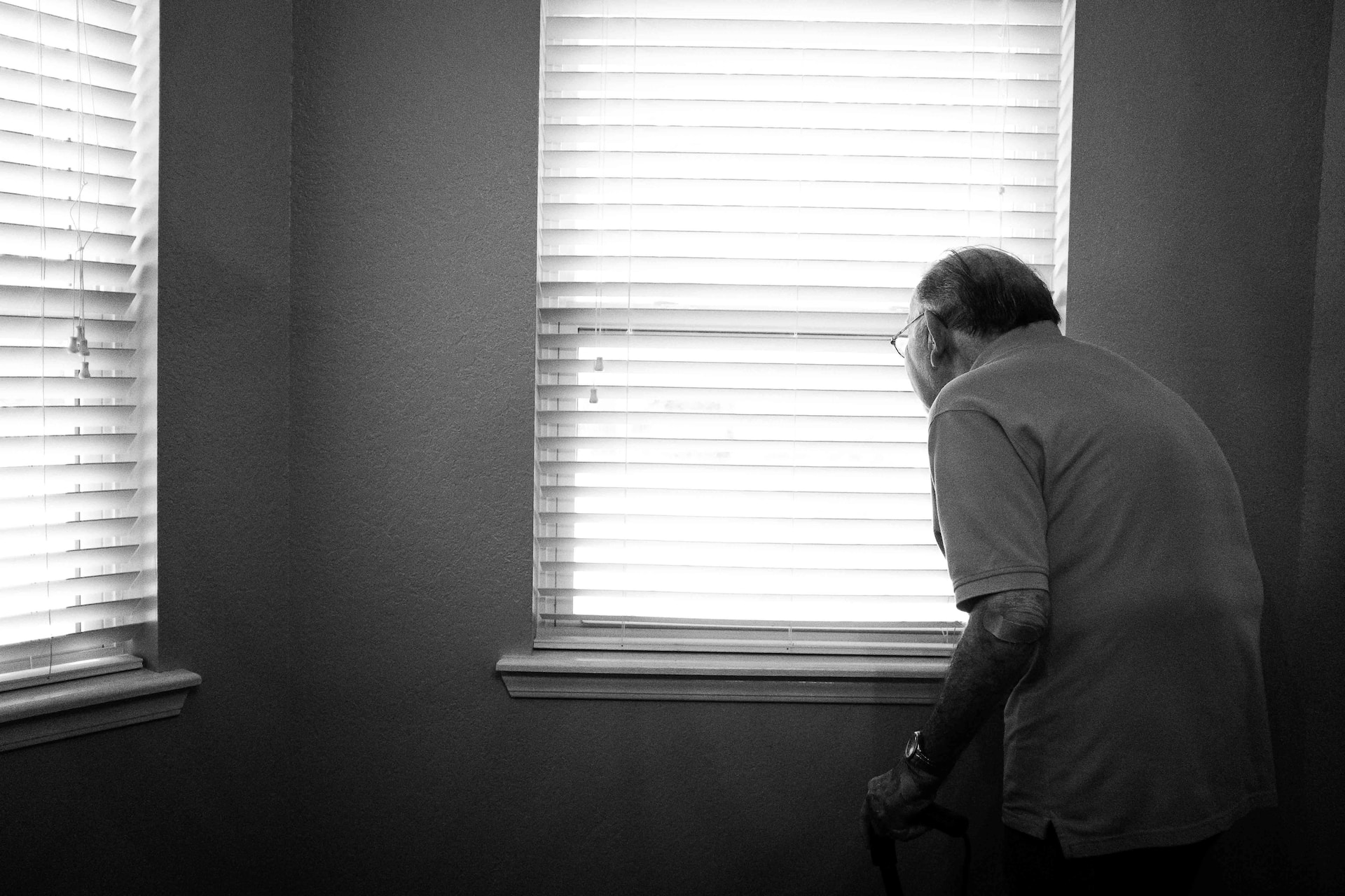 elderly looking out the window